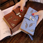 WOMEN'S WALLET WITH CUT-OUT DESIGN